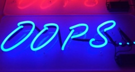 "Oops" neon sign